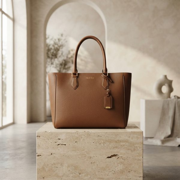 Luxury_tote_bag_on_pedestal_202607231120 (1) Modern Classics